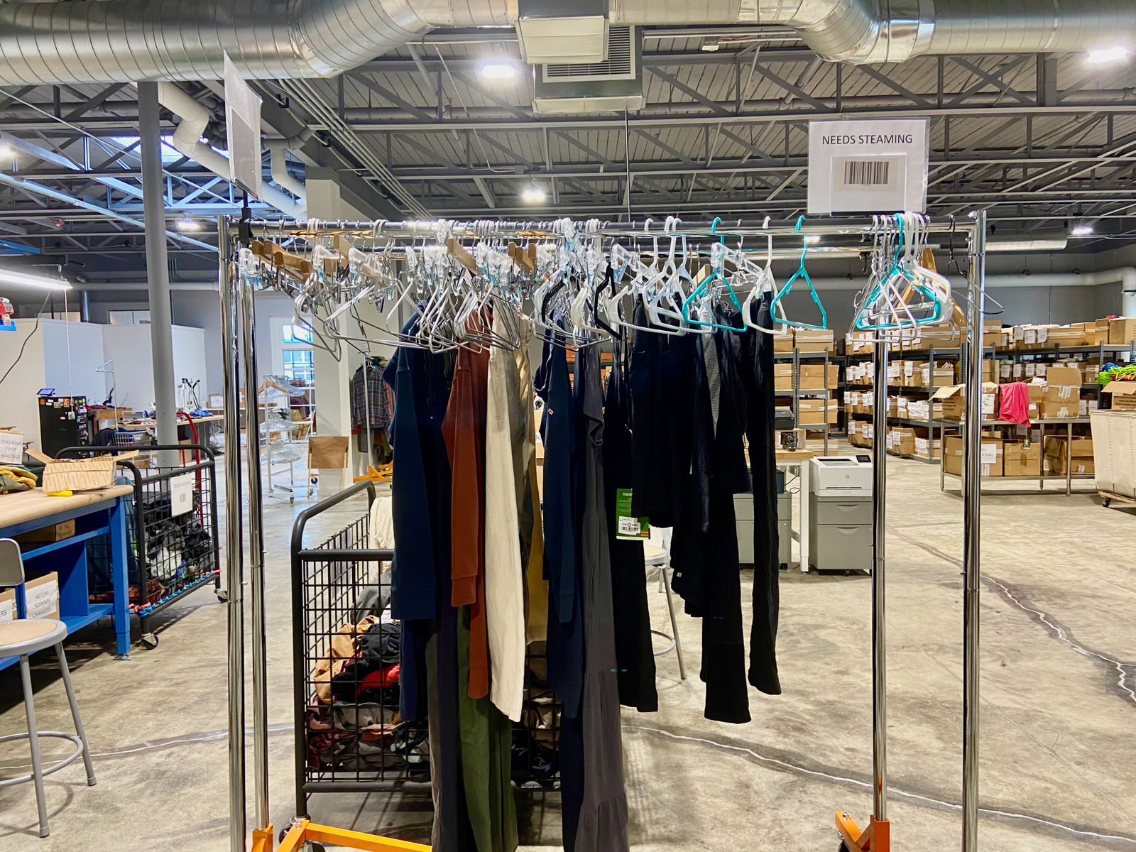 A rack of clothes at a warehouse.