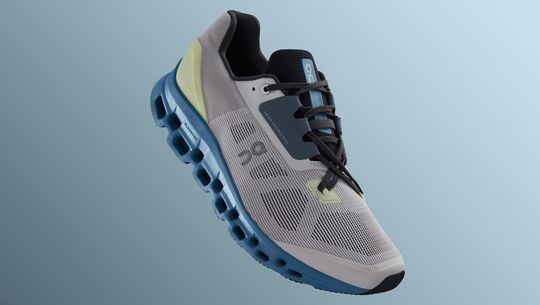 A blue and white On running sneaker with a white sole