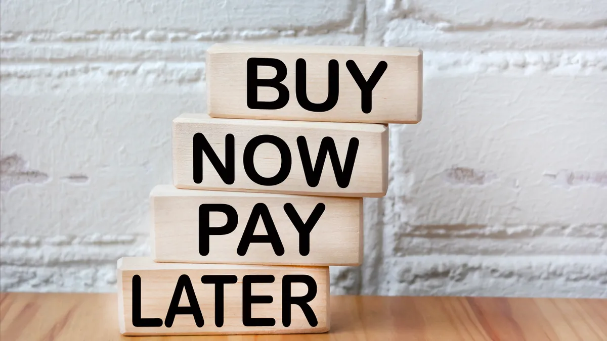 Blocks show the words "buy now pay later"