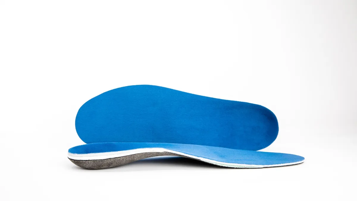 Picture of blue orthotics inserts.