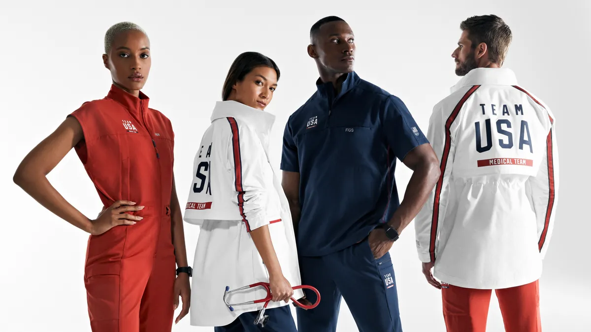 Four people wearing items for Figs' partnership with The U.S. Olympic & Paralympic Committee and The LA28 Olympic and Paralympic Games