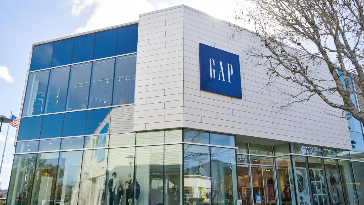 A two-story Gap clothing store, with a GAP sign in white letters on a blue square.